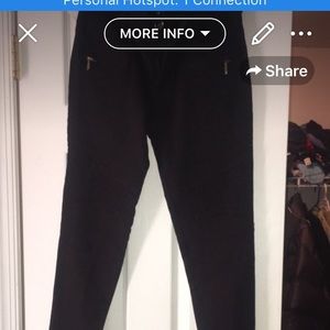 Black jeans with gold zippers